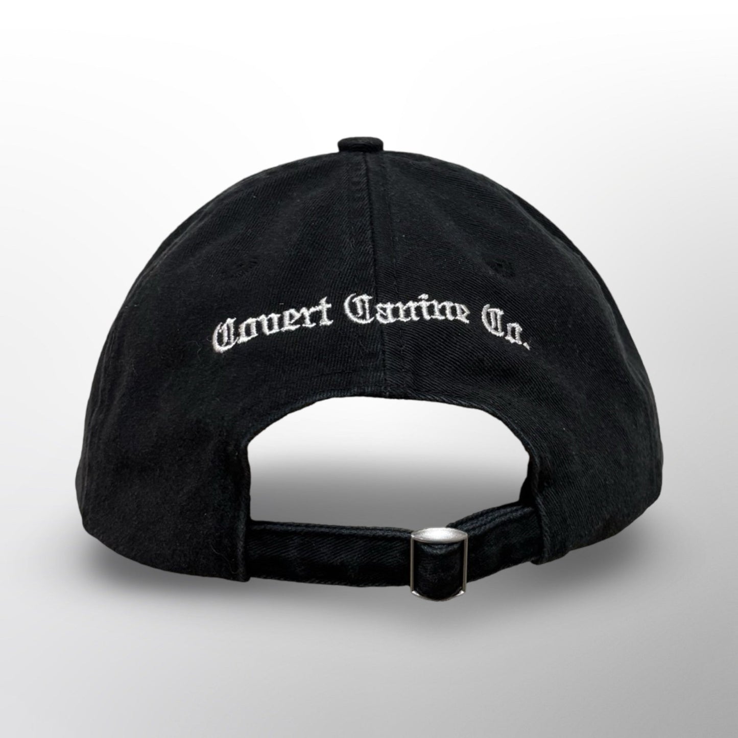 Back of the Covert Canine Co. Signature Cap with embroidered 'Covert Canine Co.' and metal buckle strap