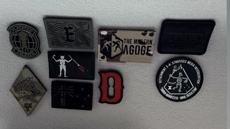 A collection of patches including a Covert Canine Co. patch.
