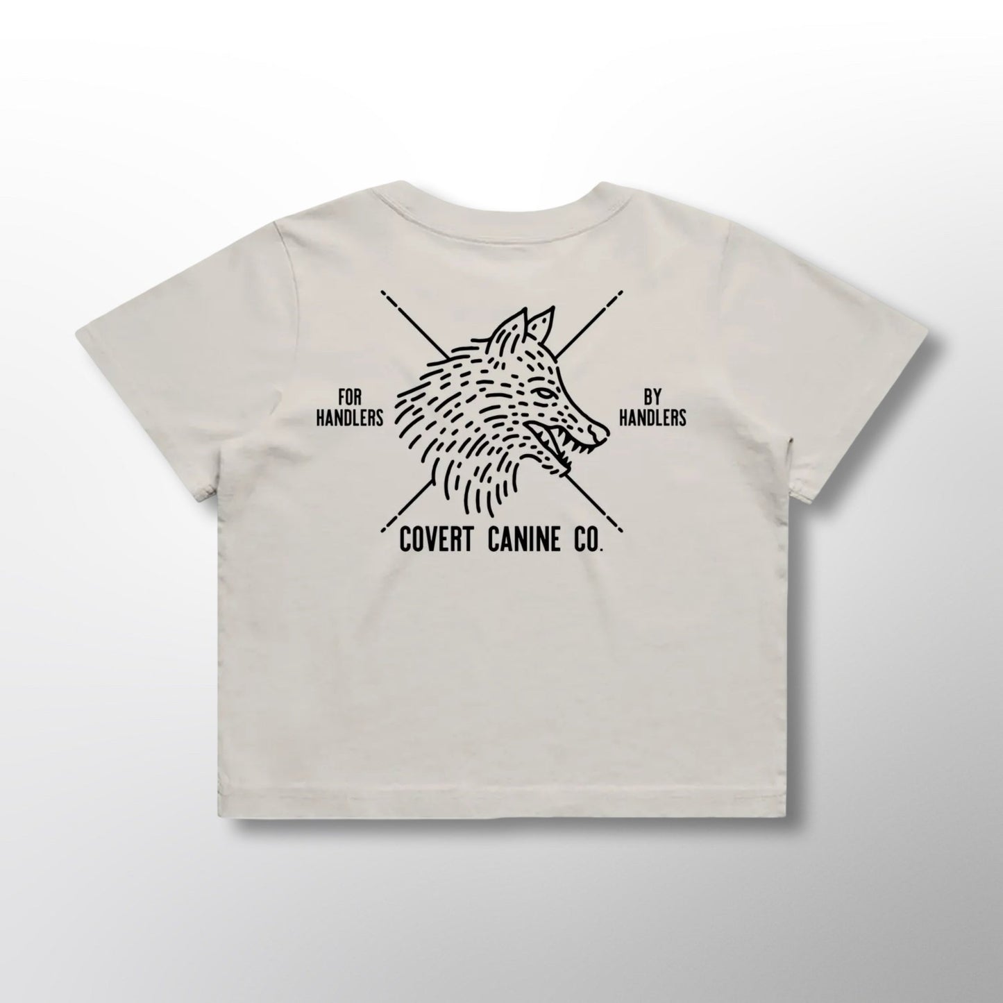 Back of white crop top with black Covert Canine Co. logo and text on a white background