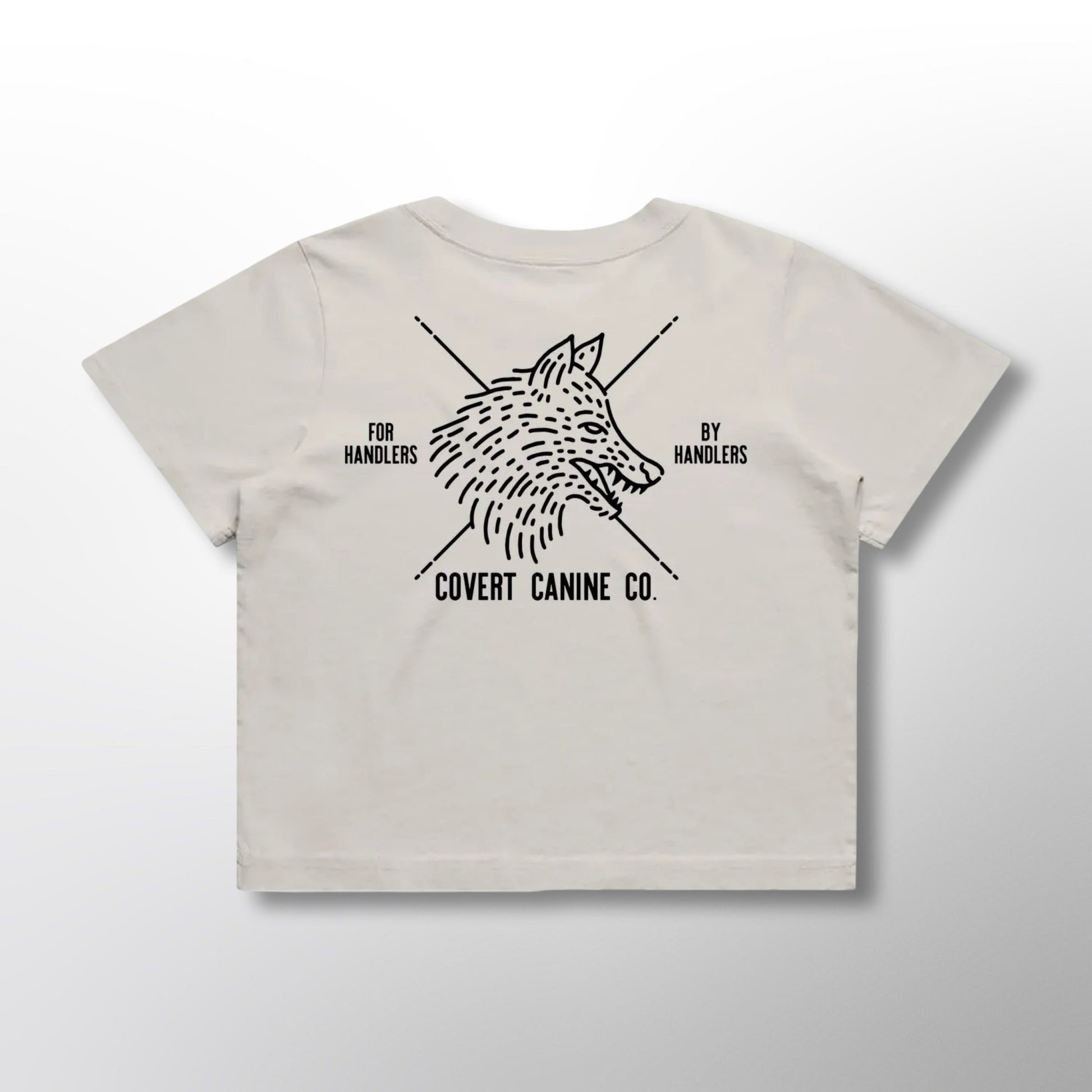 Back of white crop top with black Covert Canine Co. logo and text on a white background