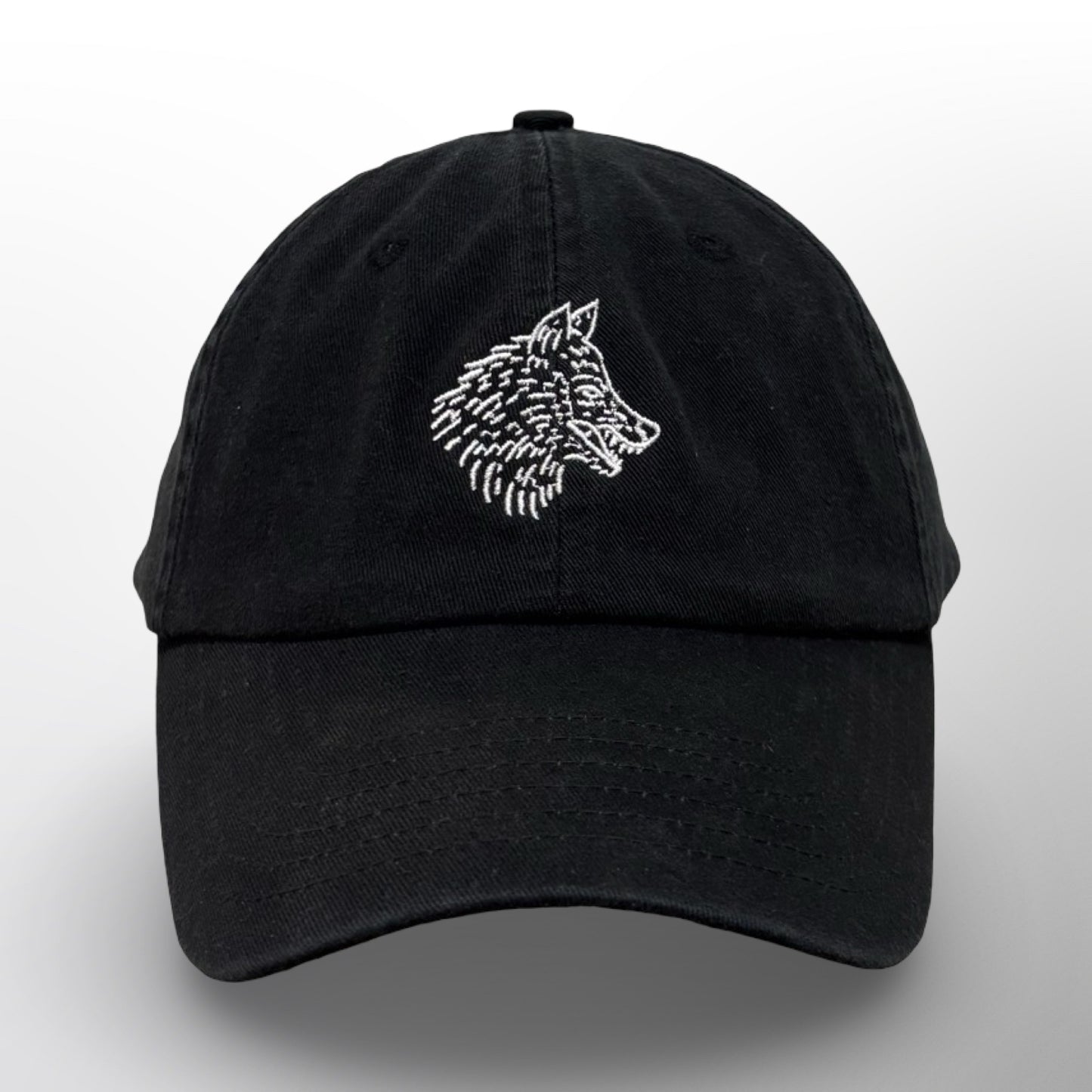 Front of the Covert Canine Co. Signature Cap with embroidered white wolf on washed black