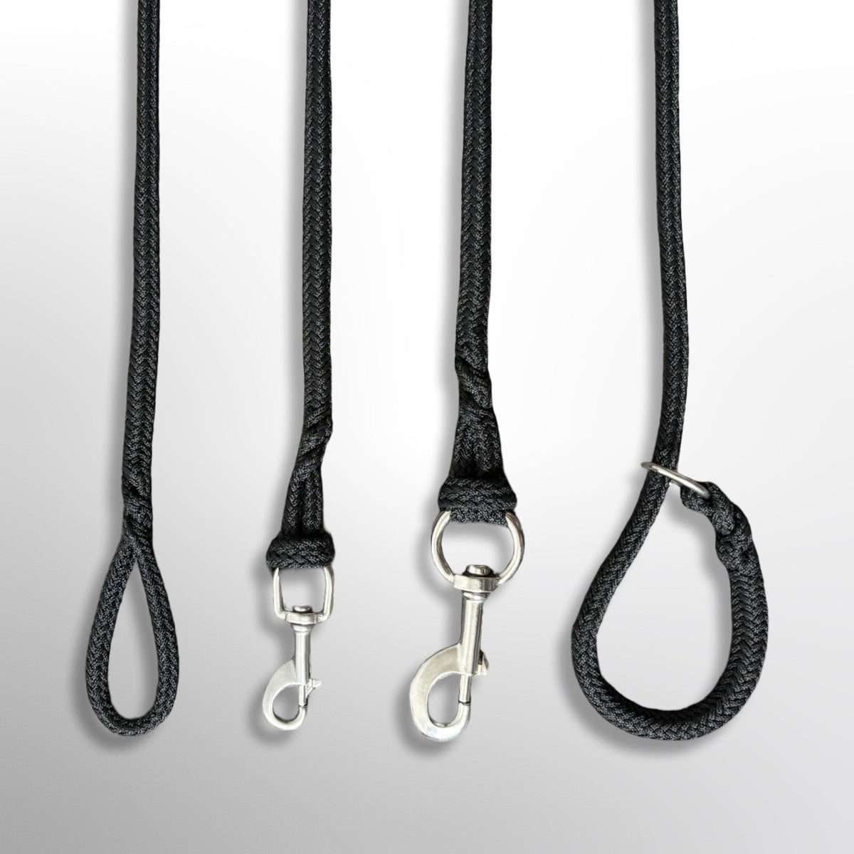 Four hardware options on the Covert Canine Co. rope tracking line, left to right: bare spliced eye with no hardware, 90mm stainless snap hook, 120mm stainless snap hook and slip lead with stainless ring