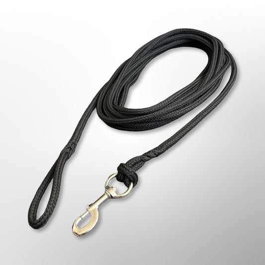 Coiled Covert Canine Co. rope tracking line with stainless steel snap hook and spliced handle