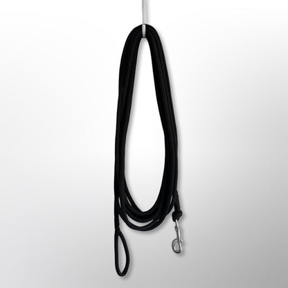 Covert Canine Co. rope tracking line hanging, showing full length, spliced handle and stainless snap hook