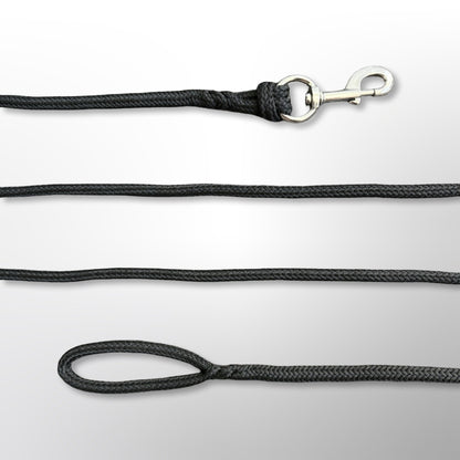 Close-up of the hand-spliced ends of a Covert Canine Co. rope tracking line, showing the snap hook and loop handle